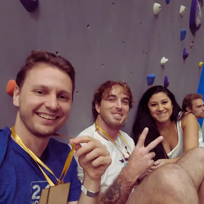 Winning a climbing competition.