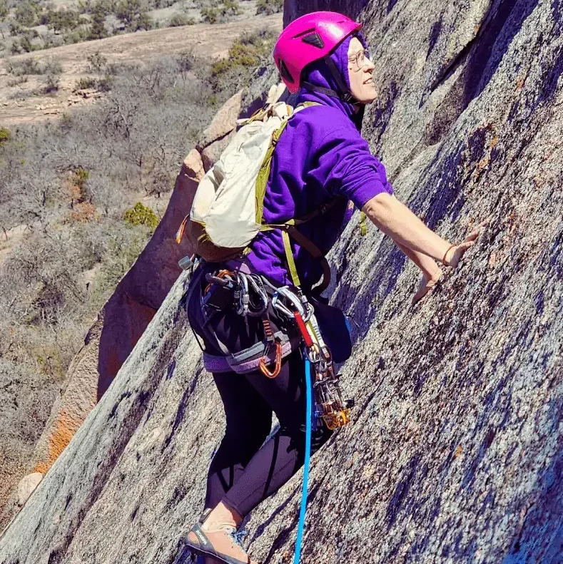 Friends climbing in Enchanted Rock.